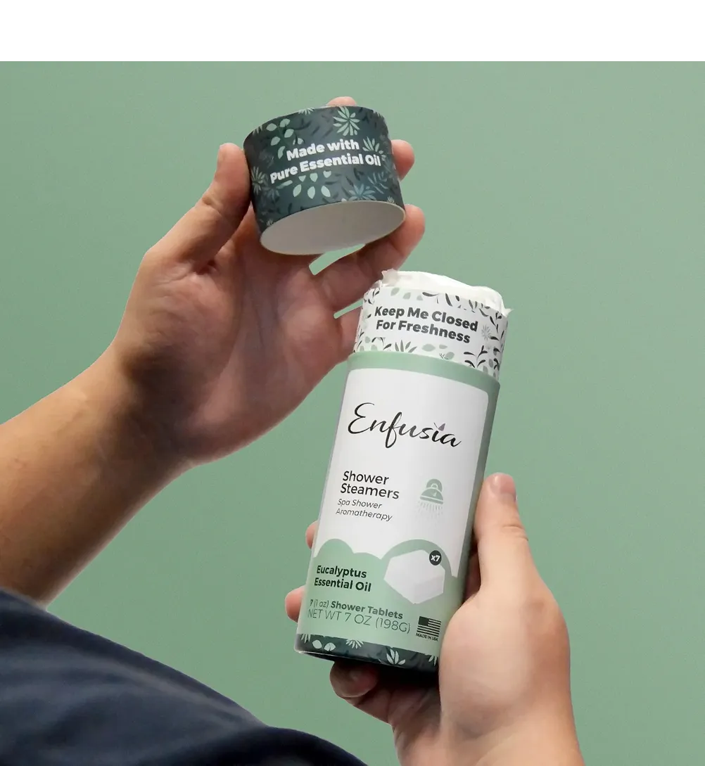 Modern wellness supplement packaging in dark green custom paper tubes with colorful label design